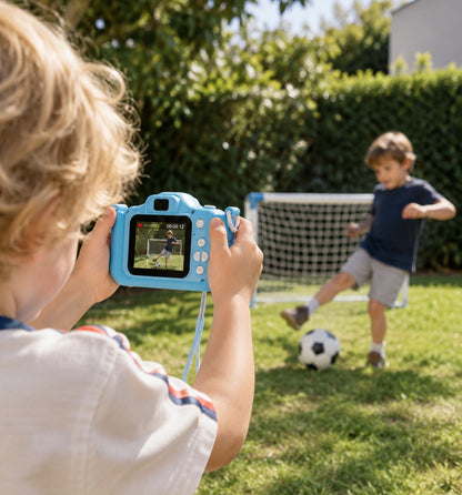 Child filming his brother playing football in the garden with a Klikko camera