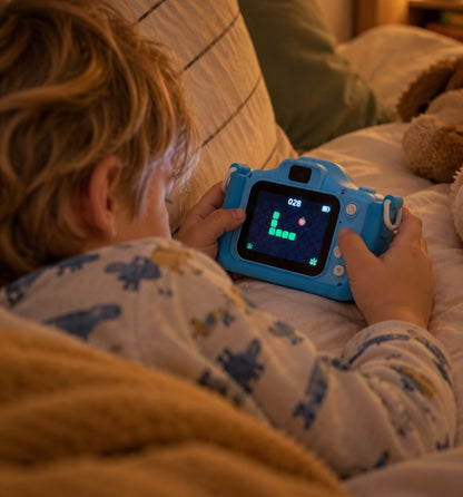 Boy playing a built-in game on the Klikko Rex kids camera